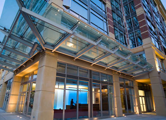 A modern building with a glass and steel structure.