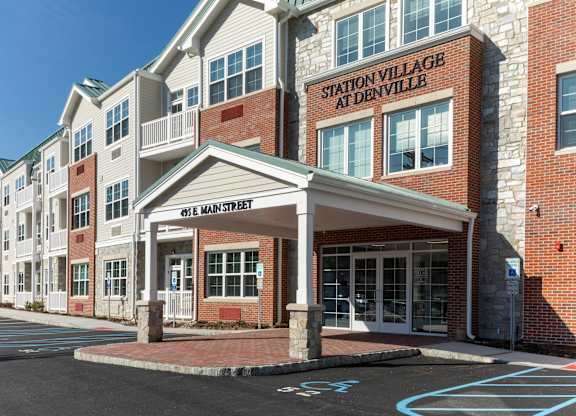 The Station Village at Denville apartment complex has a covered main entrance.