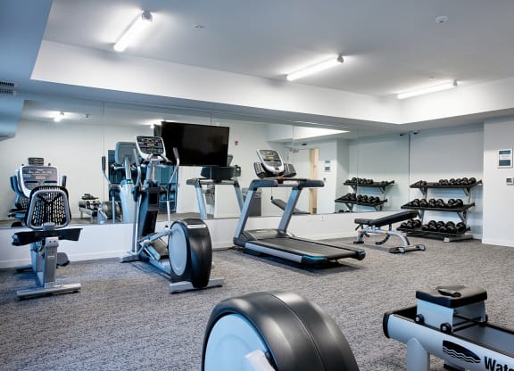 a large fitness room with treadmills and other exercise equipment at EastGate Apartments, Rochester, Minnesota