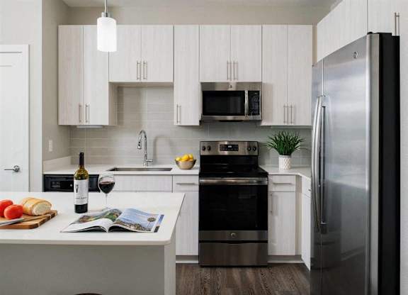 Kitchen with quartz countertops and stainless steel appliances