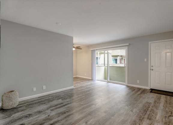 the living room and dining room of a new home