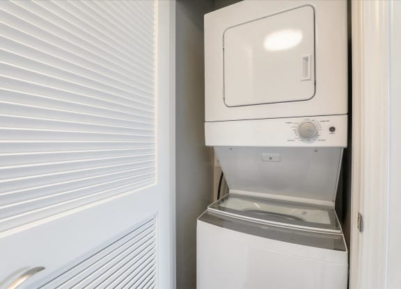 a small laundry room with a washer and dryer in it