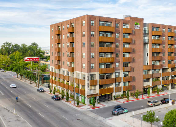 an aerial view of a brick apartment building with balconies