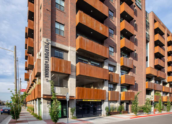 an image of the front of the building with trees in front of it