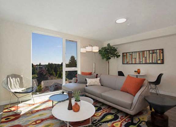 Large Open Spaced Living Room with floor to ceiling windows letting in natural light at Arabella Apartment Homes, Shoreline, Washington