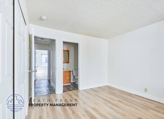 A room with a logo for Beach Front Property Management.