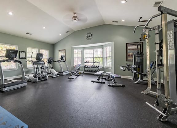 fitness center with treadmills and strength equipment
