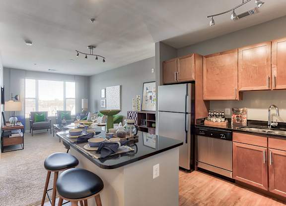 a kitchen and living room in a 555 waverly unit