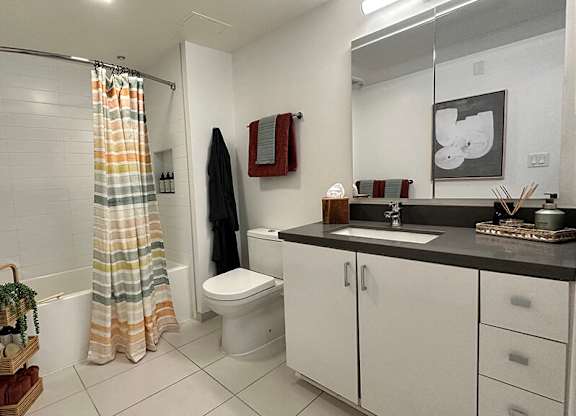Bathroom in portal finish with shower tub at Idea1 Apartments in San Diego CA