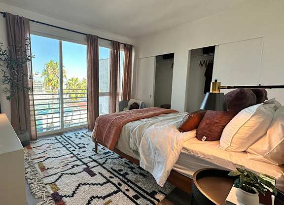 Bedroom with window at Idea1 Apartments in in San Diego CA