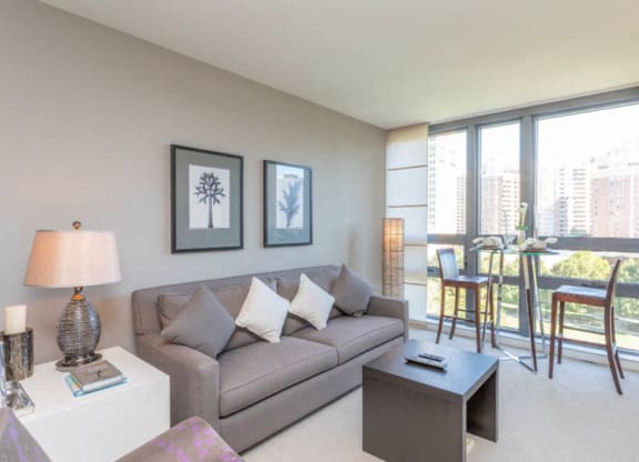 a living room with a couch and a coffee table at The Millennium, Arlington