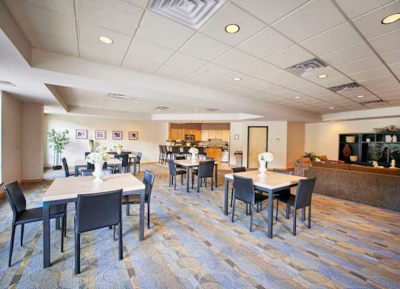 A large dining area with tables and chairs.