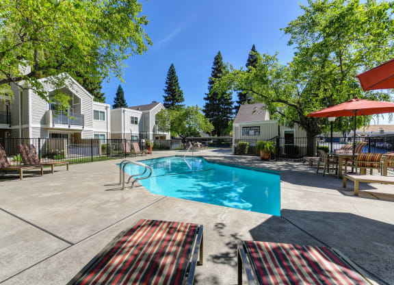 Pool Area with Trees at Rush River Apartments, Sacramento, California
