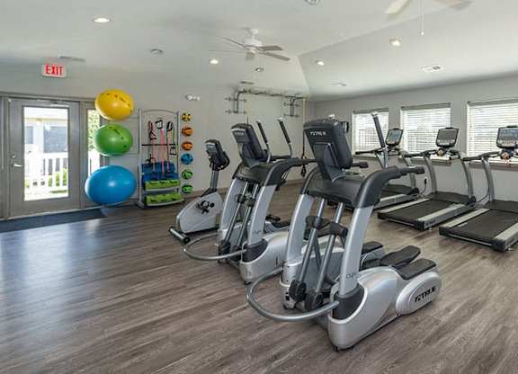 fitness center with cardio equipment