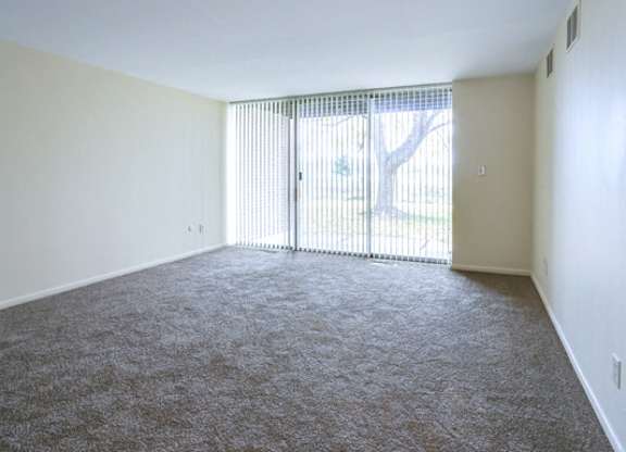 Amherst Manor Apartments - Living Room – Sliding Door – Outdoor Space - Ask for a Tour - Pet Friendly