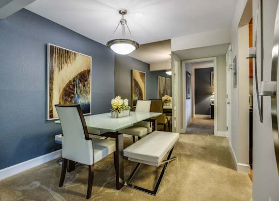 a dining room with a table and chairs