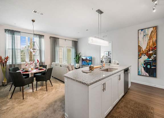 a kitchen and living room with a counter top