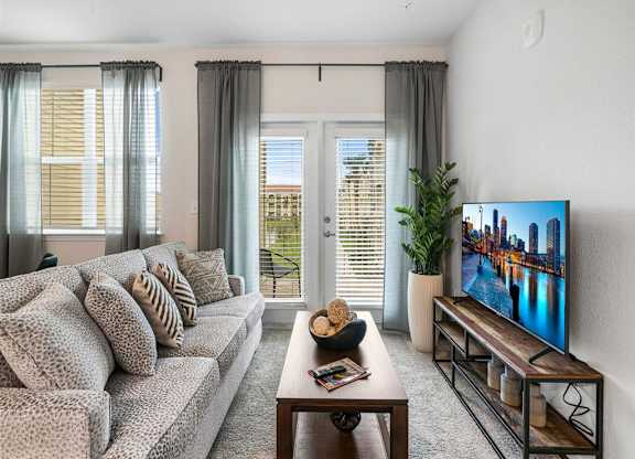 a living room with a couch and a tv