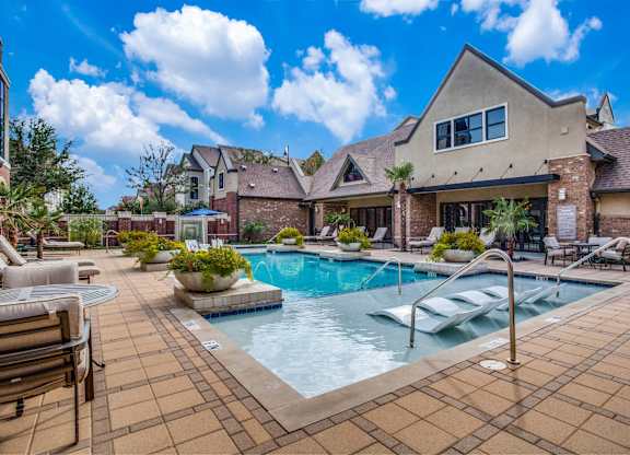 Resort style pool with lounge seating