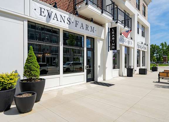 A white building with Evans Farm written on it.