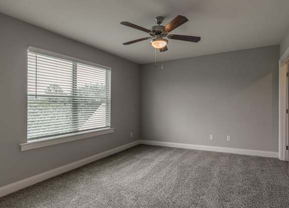 Bedroom with Large window at Mode at Melbourne, LLC Apartments, Melbourne, FL