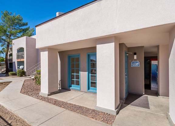 A building with a blue door and a sign that says