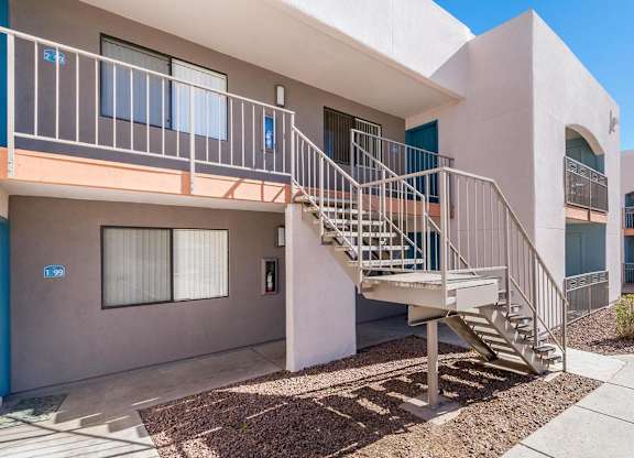 A building with a staircase leading to the second floor.