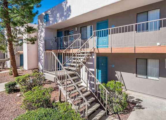 A building with a staircase leading to a balcony.