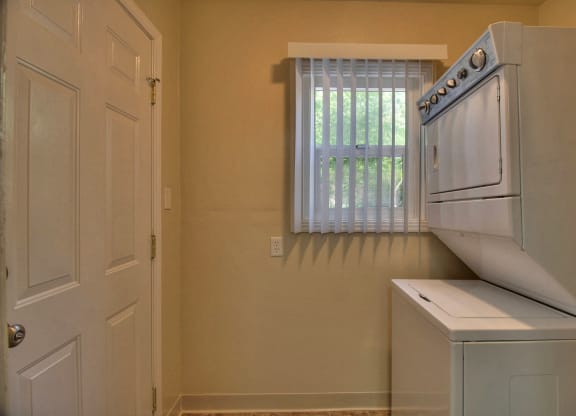 A small room with a washing machine and dryer.