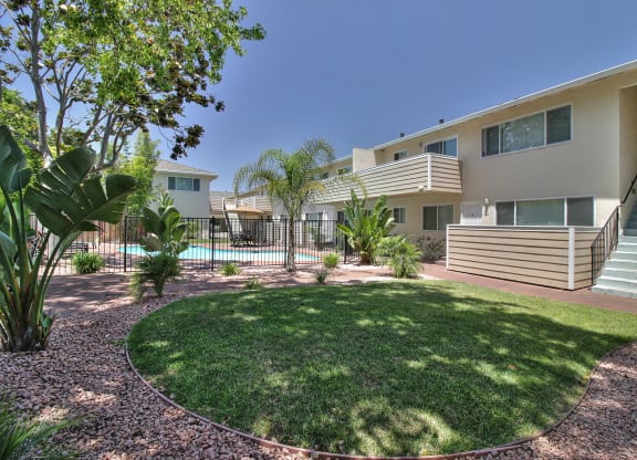 a house with a yard and a swimming pool