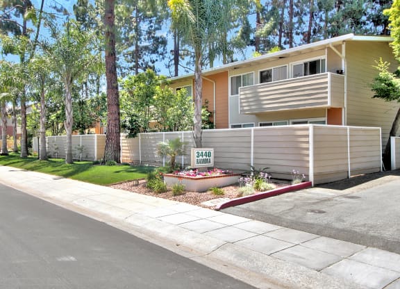 A house with a fence and a sign that says 34401 HANDLER.