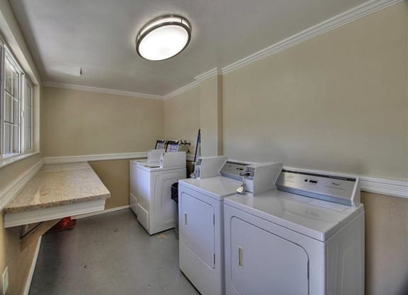 A laundry room with a washer and dryer.