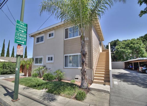 a house with a street sign in front of it