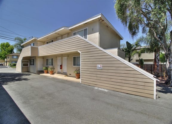 the front of a house with a ramp on the side