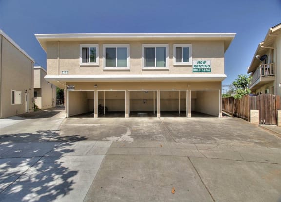 A two-story building with a sign that says