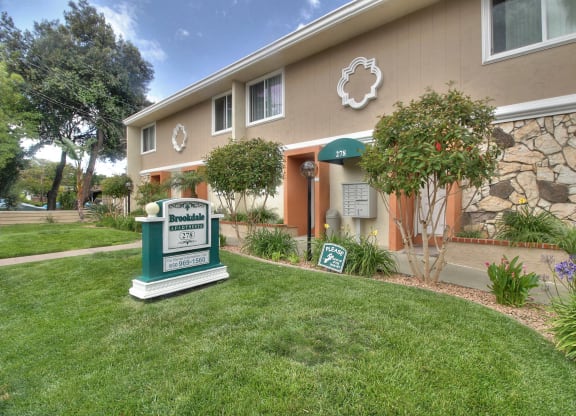 A building with a sign that says Brooksdale Estates in front of it.