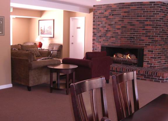 A living room with a fireplace and a couch.
