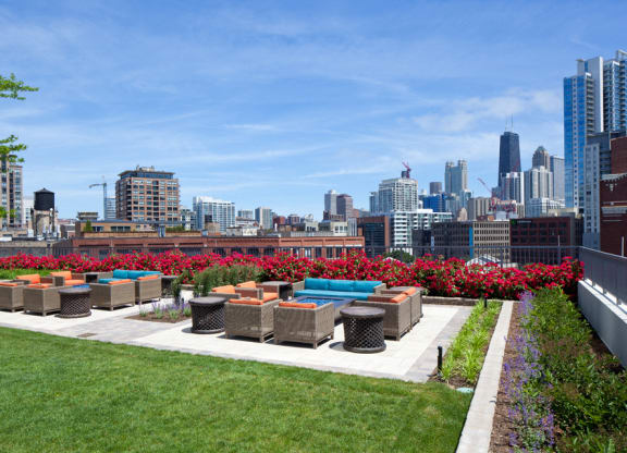 Outdoor terrace seating around fire pits during daytime at Kingsbury Plaza, Illinois