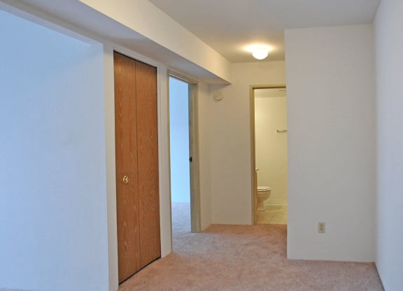 Hallway with Carpeting at Charter Oaks Apartments, Davison, MI, 48423