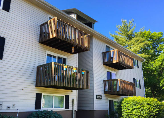 the outside of a white house with two balconies at Oakwood Apartments, Florence, 41042