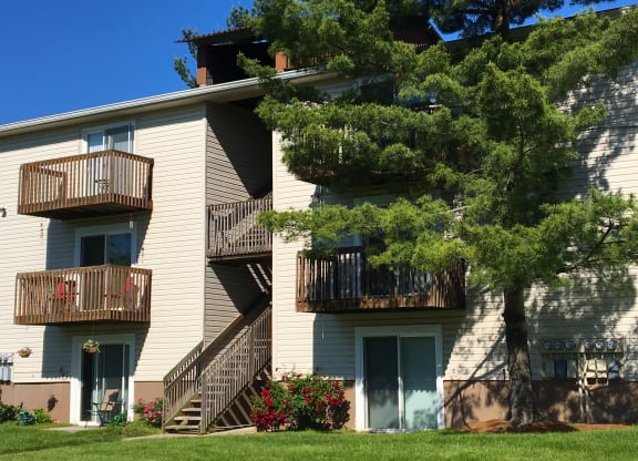 the balconies of an apartment building with stairs and trees at Oakwood Apartments, Florence, 41042