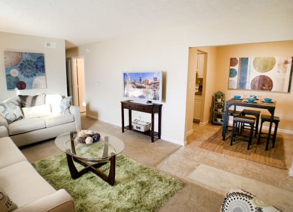 Living room with couch at Oakwood Apartments, Florence