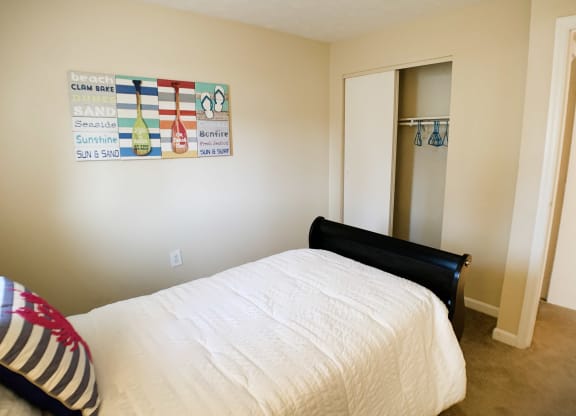 Bedroom with cozy bed at Oakwood Apartments, Kentucky