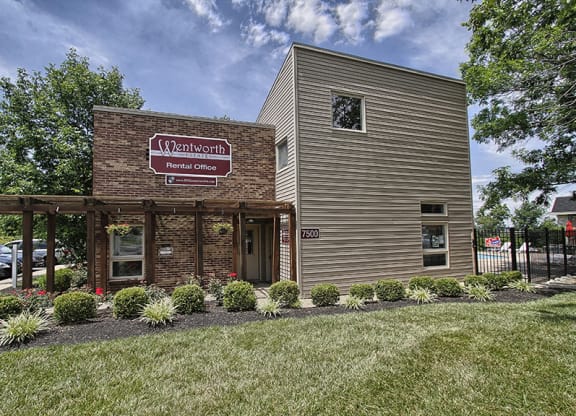 a brick building with a sign on the side of it at Wentworth Estates Apartments, Florence, KY, 41042