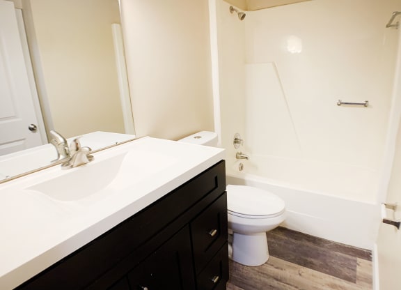 a bathroom with a toilet and a sink at Wentworth Estates Apartments, Florence, KY