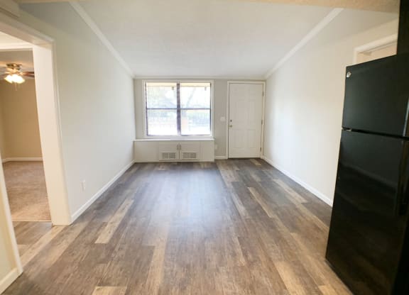 an empty living room with wood floors and a window at Wentworth Estates Apartments, Florence, 41042