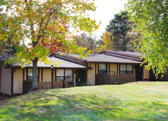 a house with a yard and trees in front of it  at Wentworth Estates Apartments, Kentucky