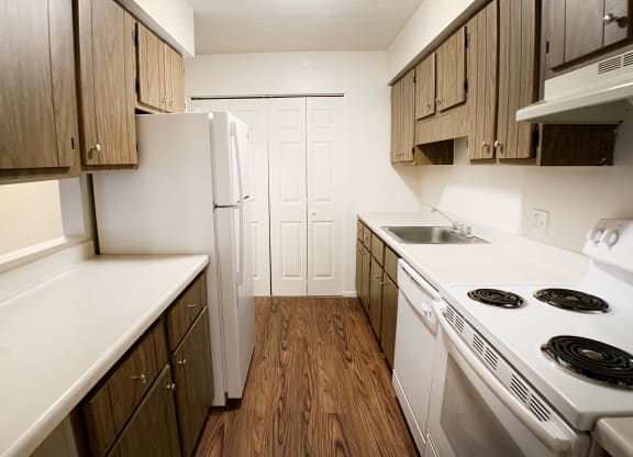 Kitchen Designed With Ample Storage Space  at Concord Woods Apartments, Milford