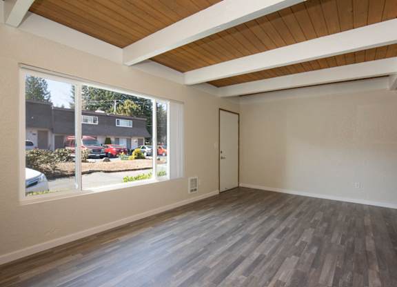 Living Space with Exposed Overhead Beams at Woodlake Townhomes, Edmonds, WA, 98026