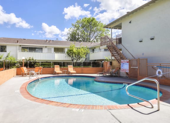 A small pool with a metal ladder.
